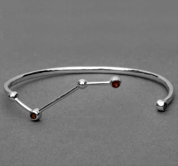Constellation-inspired open bangle bracelet with gemstone accents in silver