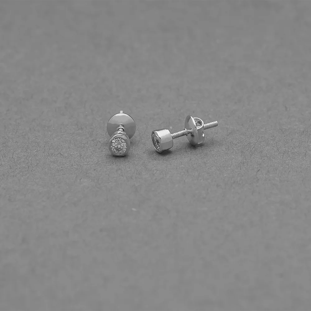 Diamond stud earrings in white metal