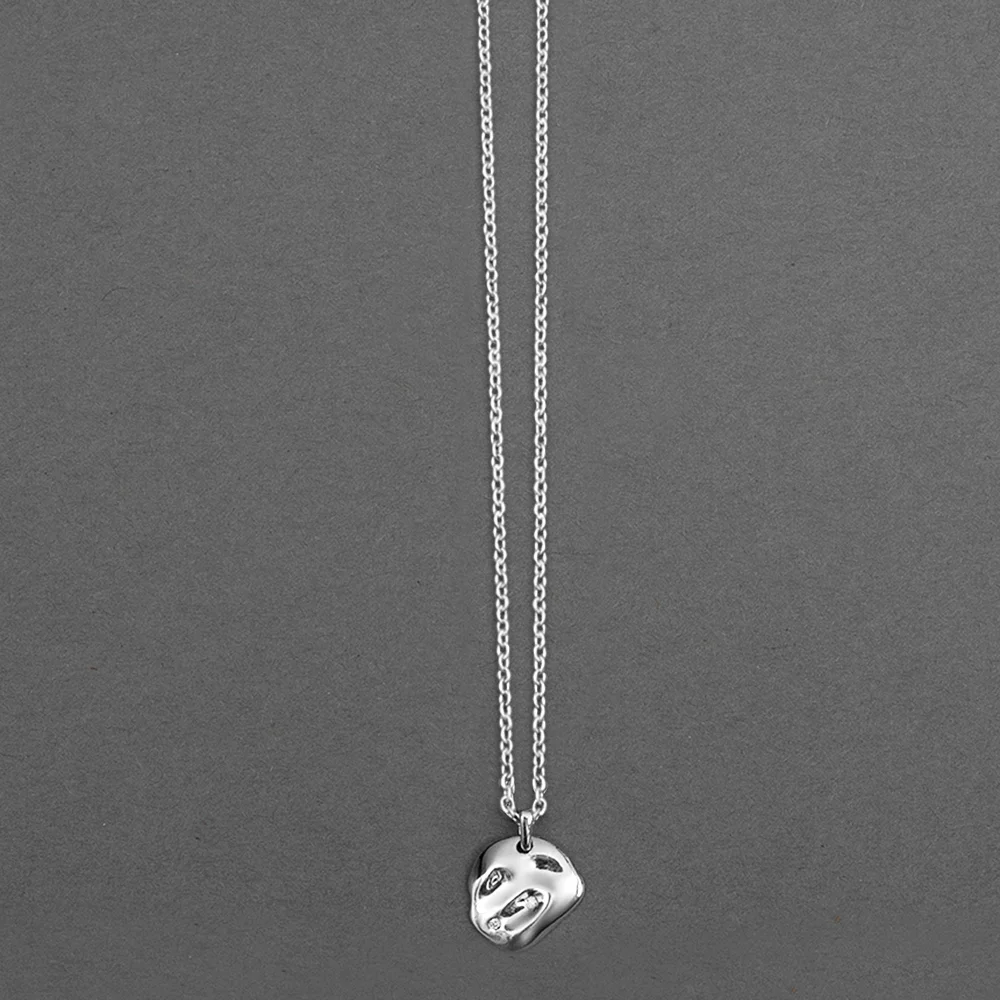 Silver abstract face pendant necklace