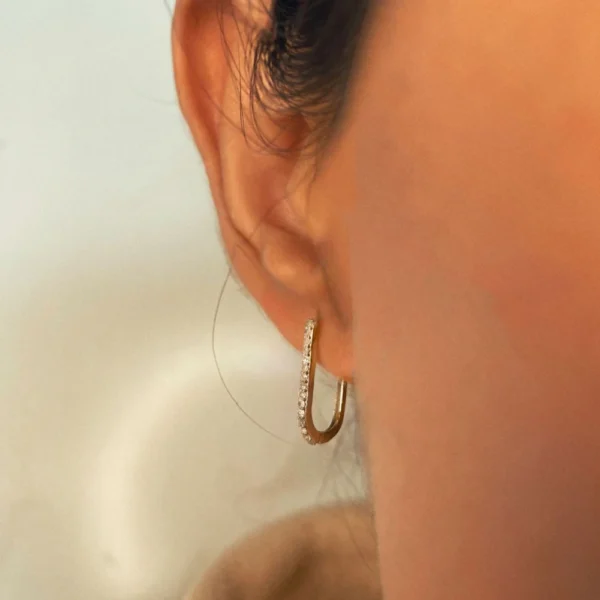 Vintage-inspired silver filigree wide hoop earrings with diamond accents.