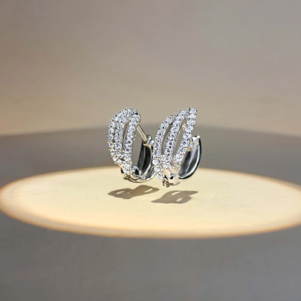 Sparkling three-band diamond hoop earrings for B2B buyers.