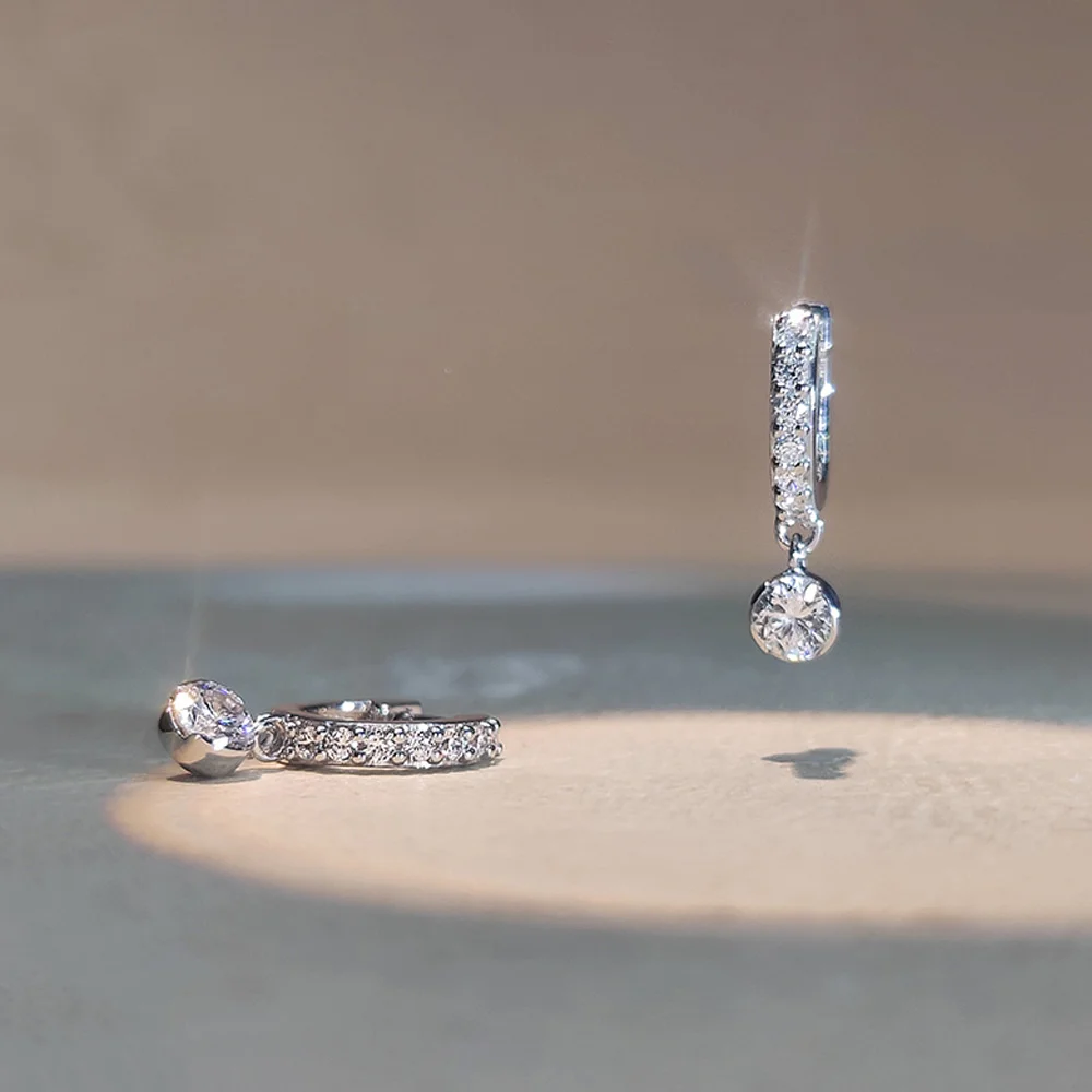 Sterling silver pavé huggie earrings with round lab grown diamond drop