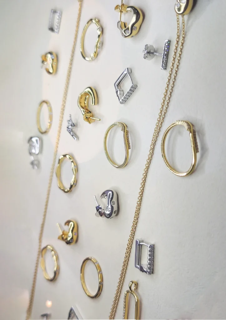 Bulk sterling silver jewellery collection featuring earrings, hoops, pendants, and chains